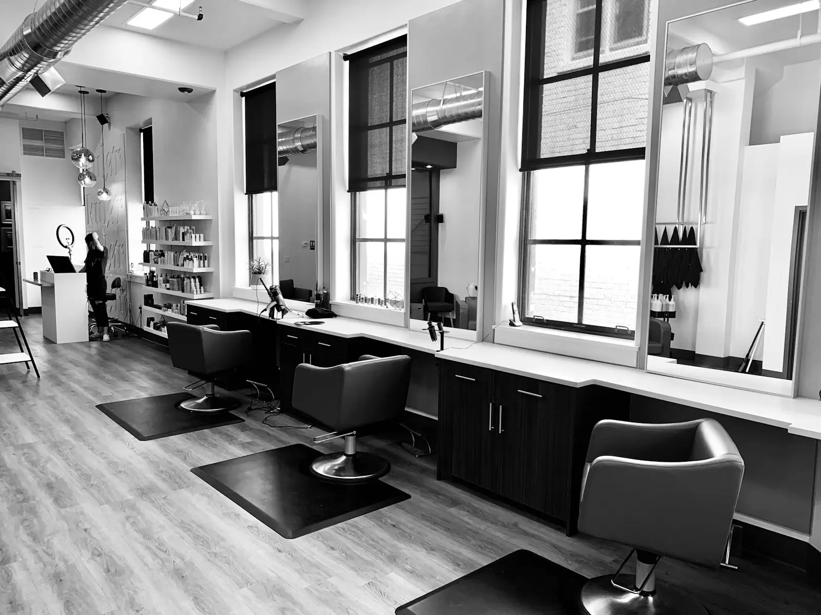 interior of a modern hair salon with styling chairs and mirrors