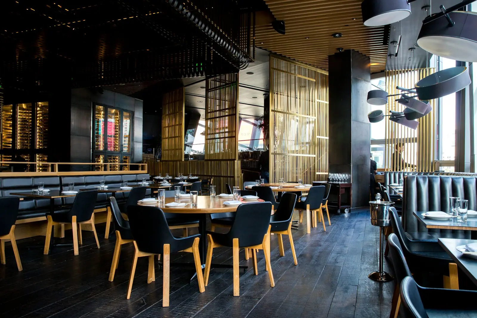 set tables and chairs inside an upscale restaurant dining room